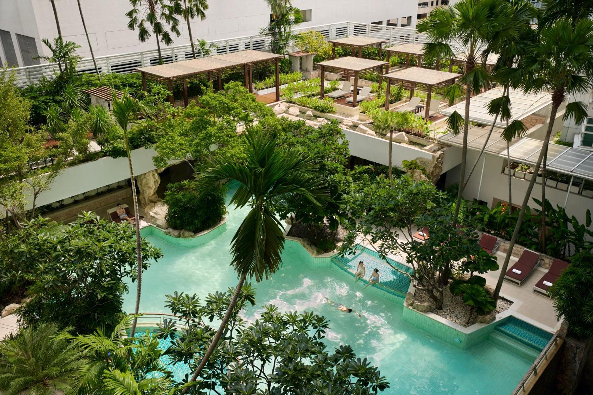 Dusit Suites Hotel Ratchadamri, Bangkok Extérieur photo The resort's lagoon